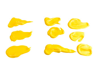 Yellow sauce splashes isolated on white background.