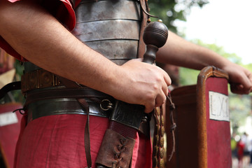 Legionary of Ancient Rome, close up of gladius and armor of infantry of Roman army