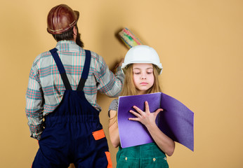 Child renovation room. Family remodeling house. Little fathers helper. Father bearded man and...