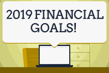 Conceptual hand writing showing 2019 Financial Goals. Concept meaning New business strategy earn more profits less investment Blank Huge Speech Bubble Pointing to the White Laptop Screen