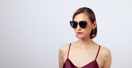 Chinese Girl wearing varies types of fashion sunglasses,looking sharp