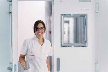 Female doctor in uniform, in the corridor of hospital