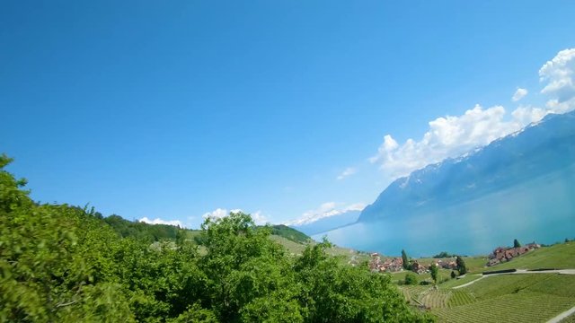 Aerial reveal of Epesses Village at Lavaux Vineyard in Vaud, Switzerland.