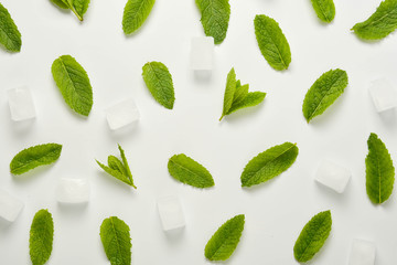 Ice cubes with mint leaves flat lay, isolated on white.