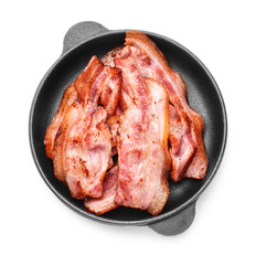 Frying pan with cooked bacon on white background