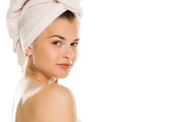 Portrait of young shirtles beautiful woman with towel on her head on white background