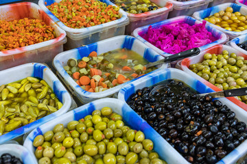 Pickles and olives at local market in Amman, Jordan. Middle East.