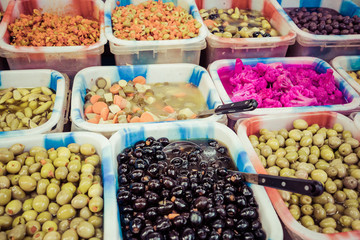 Pickles and olives at local market in Amman, Jordan. Middle East.