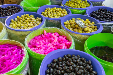 Pickles and olives at local market in Amman, Jordan. Middle East.