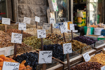 Spices, nuts and sweets shop on the market in Amman downtown, Jordan. Choice of Arabic spices on...