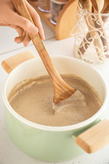 Cooking of delicious cream soup in pot