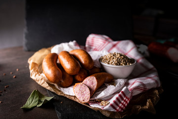  Traditional cuisine, meat composition. Smoked thin sausage.