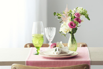 Beautiful table setting with fresh freesia flowers