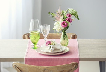 Beautiful table setting with fresh freesia flowers