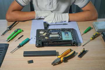 Computer repair and upgrade. Technician support upgrade part and fixing laptop.