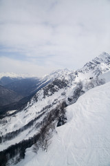 Obraz premium mountains in the snow on a background of clouds