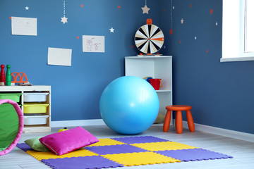 Stylish interior of modern playroom in kindergarten