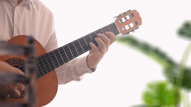 Andalusian music playing Spanish Guitar in a Patio in Cordova. Empty copy space for Editor's text.