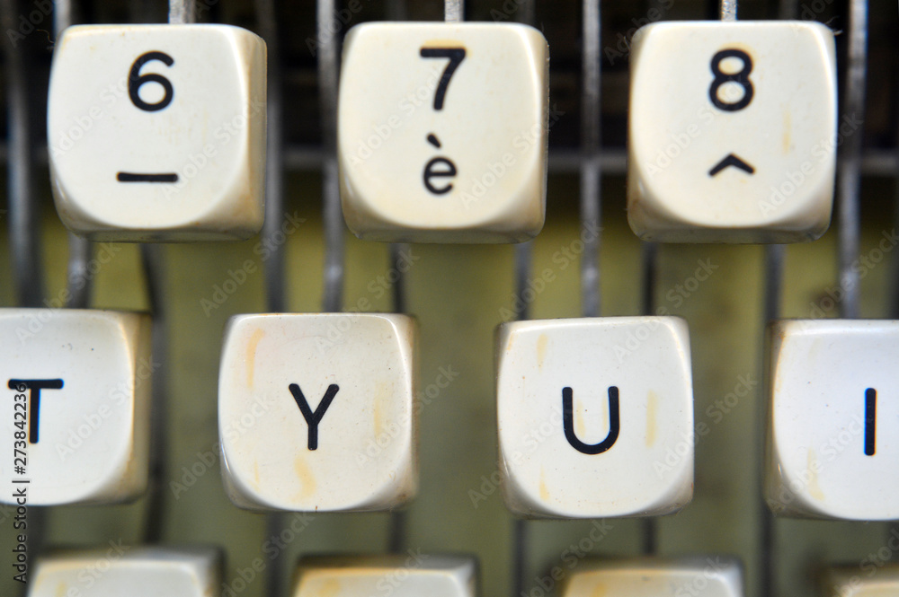 Poster detail on keys of an old typewriter