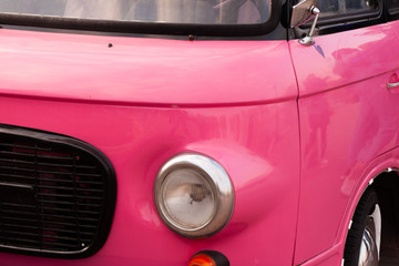 Retro pink car close up.
