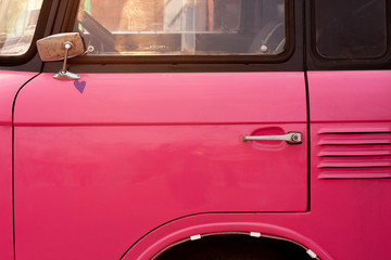 Fototapeta na wymiar Retro pink car close up.