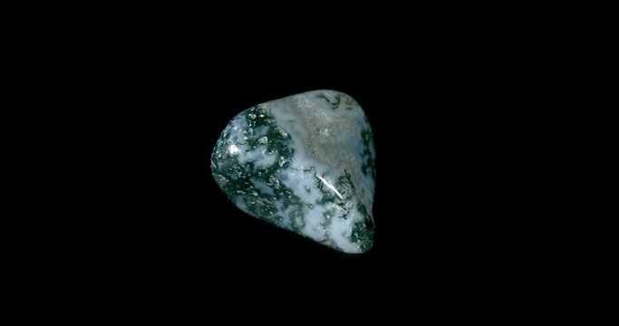Moss Agate Mineral Turning on Black