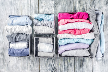 House cleaning concept. Vertical tidying up storage. Marie Kondo tidying method. Neatly folded...