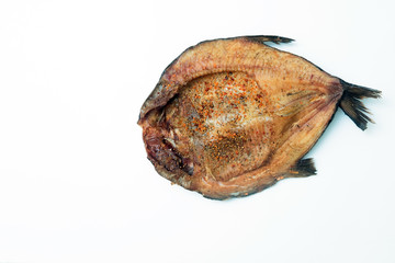 Close up horizontal view of smoked fish fillets with seasoning i