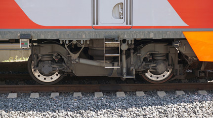 Naklejka premium Modern railway pair of wheels with shock absorbers on rails.