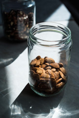 Jar of Organic Raw Almonds with Natural Light Ready to Eat.