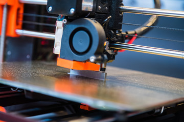 Automatic three dimensional 3d printer performs product creation. Modern 3D printing or additive...