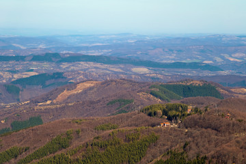 Mountain hut on top of the hill in the woods. Beautiful mountain view from the path from Beklemeto to Kozya Stena, Troyan Balkan, Bulgaria