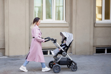 Young woman with a baby carriage.