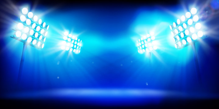 Spotlights at the sports stadium. Large illuminated stage. Vector illustration.