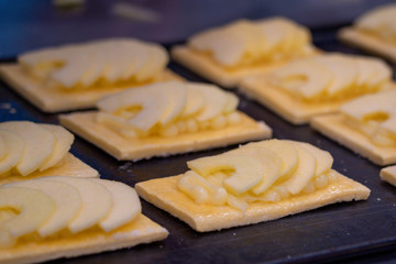 Artisan cakes of apple pie on a tray to be baked