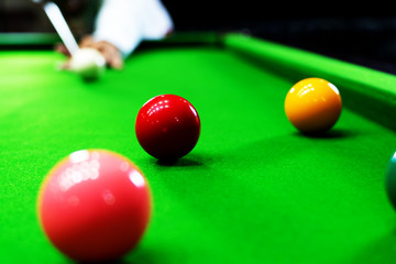 Game snooker billiards or opening frame player ready for the ball shot, athlete man kick cue on the...