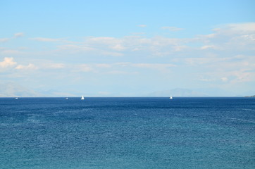 Lonely sailboat in the sea and mountain forests