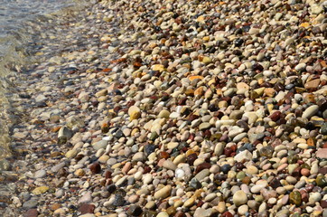 Wet pebbles by the sea