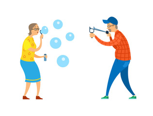Funny activity of old people, senior holding slingshot, woman blowing soap bubbles, full length view of elderly male and female in casual clothes vector