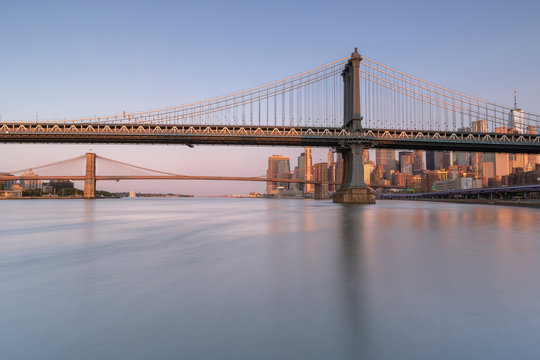 East riVer View at sunrise with Dumbo, Manhattan Bridge,  Brooklyn bridge and Financial District with long exposure photo