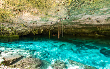 Fototapeta na wymiar Cenote Dos Ojos - Cave Two Eyes - in Mexico, peninsula Yucatan with sparkling clear turquoise water and warm water