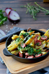 fried potatoes with sausages