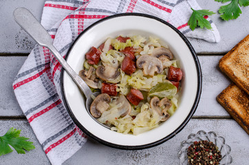 Stewed vegetables with sausages