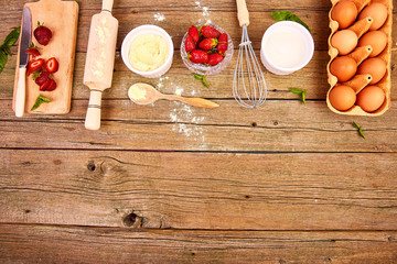 Bakery background. Recipe for strawberry pie. Raw ingredients for cooking strawberry pie or cake on rustic background. Top view, flat lay. Copy space.