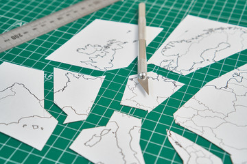 europe map with a ruler and a cutter