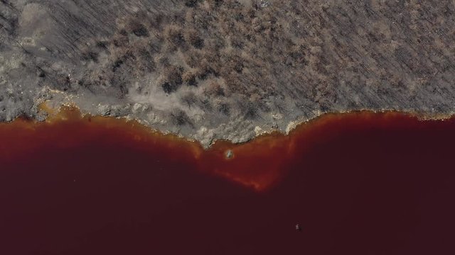 Acidic mine drainage waters and polluted coastal area 4K drone video