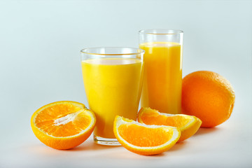 Fototapeta na wymiar Two Glasses Of Orange Juice And Fruits.