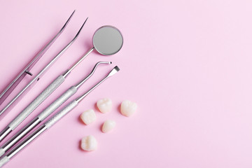 dental tools on pink background top view