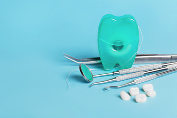 dental tools on blue background top view