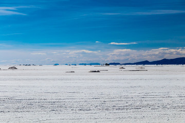 Landscape of incredibly white salt flat Salar de Uyuni, amid the Andes in southwest Bolivia, South America